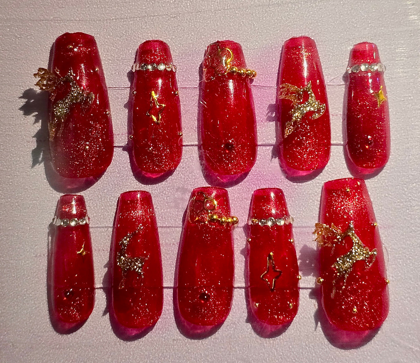 “Holiday Sparkle Nail Set – Red Glitter with Reindeer & Rhinestones”